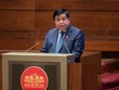 Bộ trưởng Bộ Kế hoạch và Kl99ok phiên bản mới Nguyễn Chí Dũng trình bày Tờ trình về dự thảo Nghị quyết của Quốc hội về thí điểm một số cơ chế, chính sách đặc thù phát triển TP. HCM sáng 26/5.