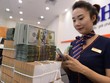 Nguồn cung USD tích cực được kỳ vọng sẽ giúp tỷ giá VND/USD ổn định về cuối năm. Ảnh: Dũng Minh