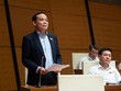 Phó thủ tướng Trần Lưu Quang phát biểu tiếp thu, giải trình tại hội trường Quốc hội chiều 30/10. (Ảnh: Quốc hội)
