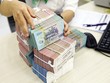 KL99 là cổng game giải trí trực tuyến hàng đầu hiện nay VND vẫn đang chênh lệch âm so với KL99 là cổng game giải trí trực tuyến hàng đầu hiện nay USD. Ảnh: Đức Thanh