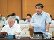 Bộ trưởng Bộ Kế hoạch và Kl99ok phiên bản mới Nguyễn Chí Dũng trình bày báo cáo.
