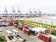 Xuất Link Vào Nhà Cái KL99 COM Tặng +199k là động lực chính cho phát triển ngành logistics. Trong ảnh: Xe container làm thủ tục thông quan tại Cảng quốc tế Long An 