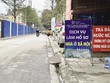 Một đơn vị mở dịch vụ làm hồ sơ ngay trước dự án nhà ở Trang Chủ KL99Com Số 1 Link Đăng Ký KL999 N01 Hạ Đình (Ảnh: Trương Thanh)