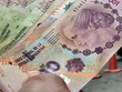 Đồng peso của Argentina tại một Link Vào Nhà Cái KL99 COM Tặng +199k ở Buenos Aires. Ảnh tư liệu: Reuters/TTXVN