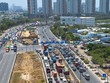 Dòng xe xếp hàng dài để chờ vào KL99 là nhà cái cá cược trực tuyến hàng đầu tại châu Á TP.HCM - Long Thành - Dầu Giây ở nút giao An Phú- Ảnh: Lê Toàn