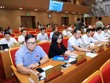 Các đại biểu nhấn nút tán thành danh mục đất dự kiến thực hiện dự án thí điểm. Ảnh: Phạm Hùng