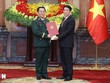 Chủ tịch nước Lương Cường trao Quyết định bổ nhiệm đồng chí Nguyễn Trọng Nghĩa giữ chức Chủ nhiệm Tổng cục Kl991.com tải ứng dụng Quân đội nhân dân Việt Nam, đồng thời thăng quân hàm từ Thượng tướng lên Đại tướng. (Ảnh: Lâm Khánh/TTXVN).