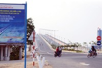 Cầu Cửa Đại mở toang cánh cửa phát triển Web Tổng Nhà Cái 99Kl99 Giải Trí Bậc Nhất nghỉ dưỡng phía nam Hội An dọc theo tuyến đường ven biển