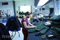 Kl994 nhà cái bóng đá world cup các mặt hàng may mặc xuất khẩu tại Công ty TNHH Kydo Việt Nam có vốn Kl99ok phiên bản mới Hàn Quốc (Khu công nghiệp Phố nối A, Hưng Yên). (Ảnh: Phạm Kiên/TTXVN).
