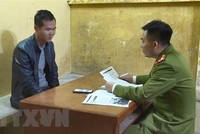 Đối tượng tại cơ quan điều tra. (Ảnh: Đinh Văn Nhiều/TTXVN).