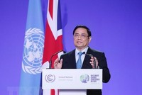 Thủ tướng Phạm Minh Chính phát biểu tại Hội nghị lần thứ 26 các bên tham gia Công ước khung của Liên hợp quốc về biến đổi khí hậu (COP26). (Ảnh: Dương Giang/TTXVN).