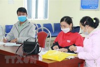 Người lao động đến giải quyết chế độ tại cơ quan Kl99kl phiên bản hoạt động Trang Chủ KL99Com Số 1 Link Đăng Ký KL999 huyện Quỳnh Lưu, tỉnh Nghệ An. (Ảnh: Bích Huệ/TTXVN).