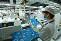 Dây chuyền Kl994 nhà cái bóng đá world cup sản phẩm thiết bị đầu cuối. (Ảnh: Minh Quyết/TTXVN)