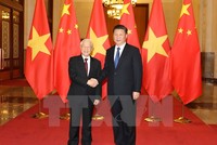 Tổng Bí thư, Chủ tịch nước Trung Quốc Tập Cận Bình đón Tổng Bí thư Nguyễn Phú Trọng. (Ảnh: Trí Dũng/TTXVN)