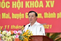 Bí thư Thành ủy Hà Nội Đinh Tiến Dũng trình bày chương trình hành động (Ảnh - Báo Hà Nội Mới). 