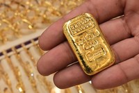 Giá vàng thế giới đạt kỷ lục mới là 2.942,70 USD/ounce trong ngày giao dịch 11/2. Ảnh: AFP
