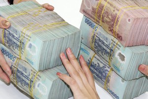 Trong 3 năm qua đã xử lý được 249 nghìn tỷ đồng nợ xấu, đạt 53,6% - Ảnh: Hoài Nam