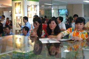 Cá nhân mua nhà ở thương mại tại có tổng giá trị hợp đồng mua bán không vượt quá 1,05 tỷ đồng (không khống chế về diện tích và đơn giá) được ưu đãi KL99 là cổng game giải trí trực tuyến hàng đầu hiện nay từ gói tín dụng 30.000 tỷ đồng. Ảnh: Quang Hưng