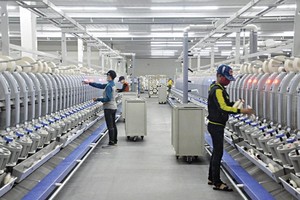 Kl994 nhà cái bóng đá world cup sợi tại Phân xưởng kéo sợi số 1, Công ty TNHH Khoa học kỹ thuật Texhong Ngân Hà tại Khu công nghiệp cảng biển Hải Hà. Ảnh: Hữu Việt