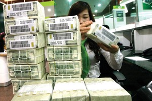 NHNN giảm KL99 là cổng game giải trí trực tuyến hàng đầu hiện nay tiền gửi USD đối với cá nhân xuống 0% với hy vọng giảm găm giữ ngoại tệ, từ đó giảm áp lực lên tỷ giá. Ảnh: Đ.T