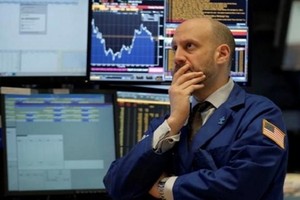 Nhân viên giao dịch trên sàn 99Kl99 link đăng nhập New York. Ảnh: Reuters.