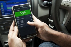 Ứng dụng Grab đang gây tranh cãi lớn ở Việt Nam (Ảnh minh họa).
