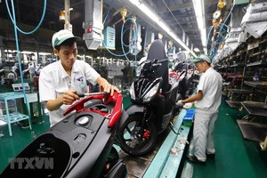 Dây chuyền lắp ráp xe gắn máy tại Công ty TNHH Honda Việt Nam, vốn Kl99ok phiên bản mới của Nhật Bản tại Vĩnh Phúc. (Ảnh: Danh Lam/TTXVN).