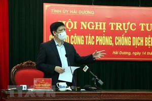 Ủy viên Trung ương Đảng, Bộ trưởng Bộ Y tế Nguyễn Thanh Long phát biểu tại hội nghị. (Ảnh: Mạnh Tú/TTXVN).