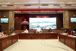 Phó Bí thư Thành ủy Hà Nội Nguyễn Văn Phong thông tin tại phiên họp báo chiều 20/8. (Ảnh: PV/Vietnam+).