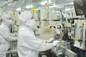Kl994 nhà cái bóng đá world cup linh kiện bán dẫn tại Công ty MTEX Nhật Bản. (Nguồn: sggp.org.vn)
