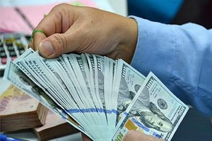 Tỷ giá trung tâm lần đầu tiên giảm trong năm 2016 (Ảnh Internet)