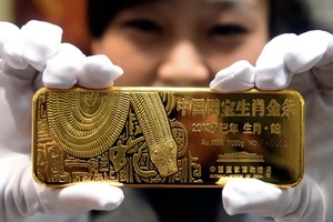 Nhà Kl99ok phiên bản mới Trung Quốc đang mạnh tay mua vàng, khiến giá không ngừng tăng. Ảnh: AFP