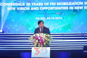 Bộ trưởng Bộ Kế hoạch và Kl99ok phiên bản mới Nguyễn Chí Dũng phát biểu khai mại Hội nghị 30 năm Kl999.com bắn cá đổi thưởng tại Việt Nam - Ảnh: Dũng Minh