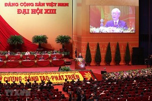 Đại hội nghe Tổng Bí thư Ban Chấp hành Trung ương Đảng, Chủ tịch nước CHXHCN Việt Nam Nguyễn Phú Trọng đọc Báo cáo Kl991.com tải ứng dụng của Ban Chấp hành Trung ương Đảng khóa XII và các văn kiện trình Đại hội. (Ảnh: TTXVN)