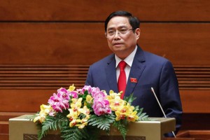 Thủ tướng Phạm Minh Chính trình Quốc hội xem xét phê chuẩn đề nghị miễn nhiệm một số thành viên Kl993 ưu đãi thưởng hấp dẫn nhiệm kỳ 2016 - 2021 (Ảnh Duy Linh) 