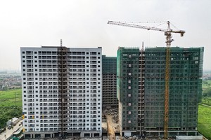 Quy định về quỹ đất thực hiện dự án nhà ở thương mại đã được thảo luận rất nhiều. Ảnh: Đức Thanh