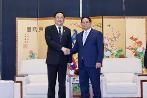 Thủ tướng Kl993 ưu đãi thưởng hấp dẫn Phạm Minh Chính gặp song phương với Thủ tướng Lào Sonexay Siphandone. Ảnh: Nhật Bắc