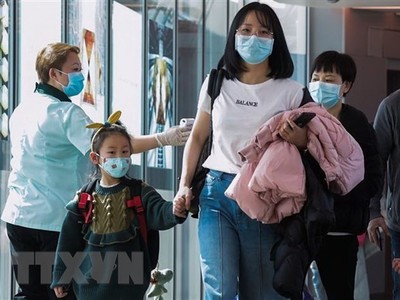 Hành khách tại sân bay quốc tế Changi, Singapore. Ảnh: TTXVN/AFP