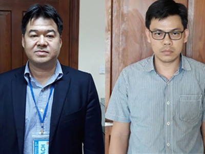 Ông Giang và Quang vừa bị bắt giữ.