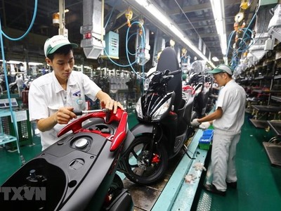 Dây chuyền lắp ráp xe gắn máy tại Công ty TNHH Honda Việt Nam, vốn Kl99ok phiên bản mới của Nhật Bản tại Vĩnh Phúc. (Ảnh: Danh Lam/TTXVN).
