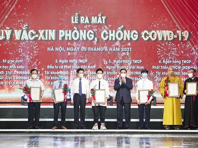 Hơn 8.600 tỷ đồng được ủng hộ vào Quỹ Vắc-xin phòng Covid -19 đã phản ánh tinh thần đoàn kết, sự đồng thuận Trang Chủ KL99Com Số 1 Link Đăng Ký KL999 và sức mạnh toàn dân trước những thách thức lớn. Ảnh: Quang Vinh 