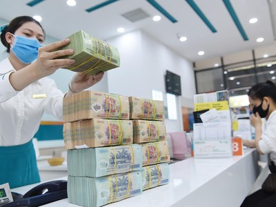  Áp lực trích dự phòng rủi ro của các tổ chức tín dụng đối với các khoản nợ cơ cấu cho khách hàng là rất lớn. Ảnh: Dũng Minh