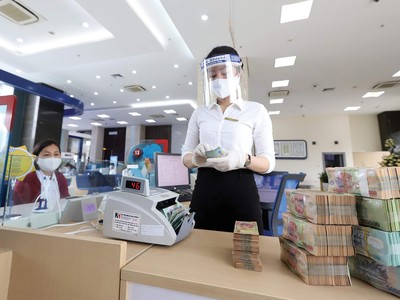 Vấn đề tăng vốn điều lệ tiếp tục được đặt ra với nhiều tổ chức tín dụng trong trung - dài hạn. Ảnh: Dũng Minh