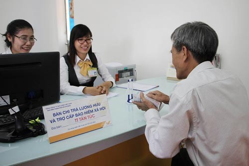 Lộ trình triển khai rộng rãi ứng dụng công nghệ thông tin trong chi trả lương hưu, trợ cấp BHXH ảnh 1