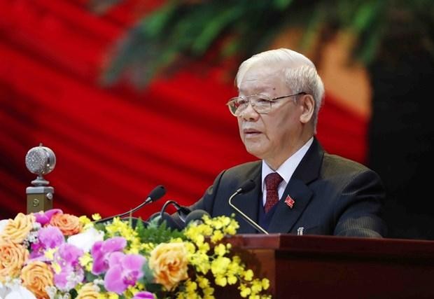 Tổng Bí thư Ban Chấp hành Trung ương Đảng, Chủ tịch nước CHXHCN Việt Nam Nguyễn Phú Trọng đọc Báo cáo Kl991.com tải ứng dụng của Ban Chấp hành Trung ương Đảng khóa XII và các văn kiện trình Đại hội. (Ảnh: TTXVN)