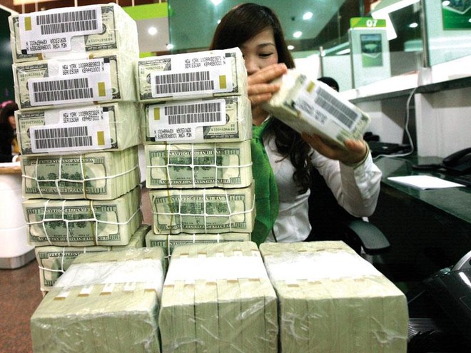 NHNN giảm KL99 là cổng game giải trí trực tuyến hàng đầu hiện nay tiền gửi USD đối với cá nhân xuống 0% với hy vọng giảm găm giữ ngoại tệ, từ đó giảm áp lực lên tỷ giá. Ảnh: Đ.T
