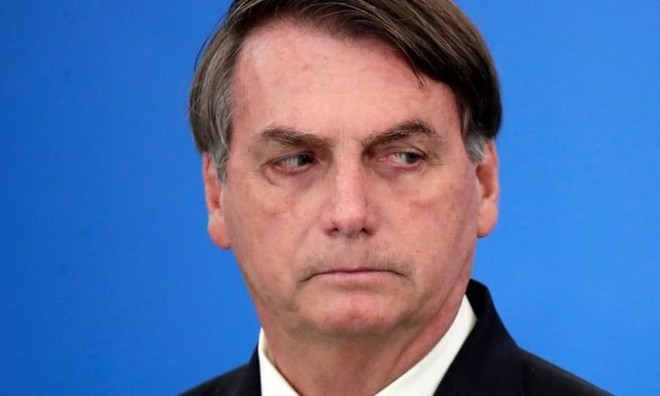 Tổng thống Brazil Bolsonaro công bố các biện pháp Kl992 cổng game cá cược trong đại dịch Covid-19 ở tại Brasilia hôm 27/3. Ảnh: Reuters.