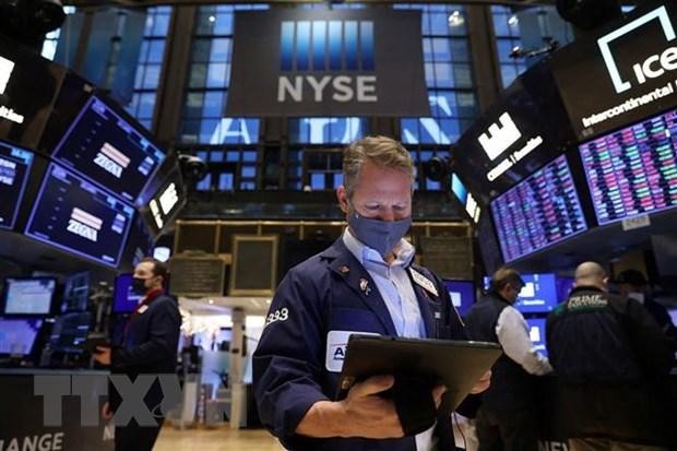 Giao dịch viên theo dõi các chỉ số tại sàn 99Kl99 link đăng nhập New York, Mỹ. (Nguồn: Reuters/TTXVN)
