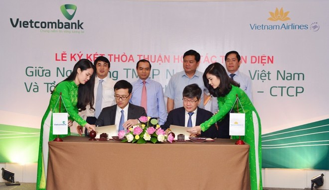 Lễ ký kết thỏa thuận hợp tác giữ Vietcombank và Vietnam Airlines có sự chứng kiến của Bộ trưởng Bộ KL99 là cổng game giải trí trực tuyến hàng đầu hiện nay Vận tải Đinh La Thăng và Phó thống đốc NHNN Nguyễn Đồng Tiến