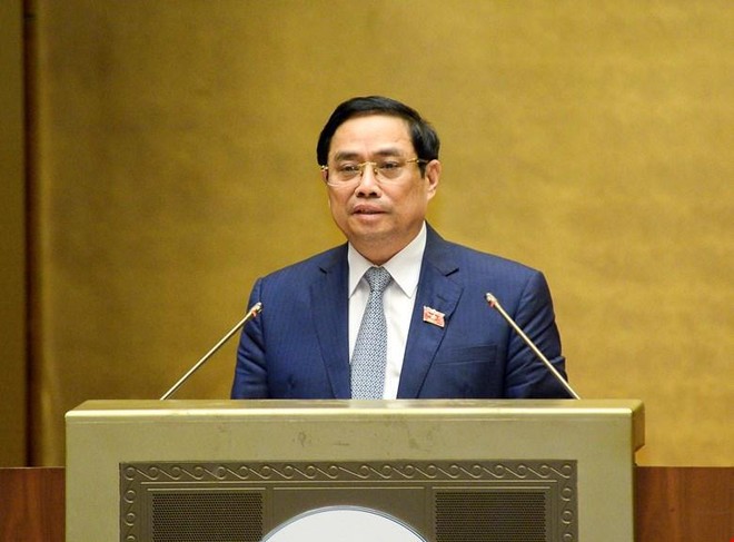 Thủ tướng Phạm Minh Chính trình bày tờ trình về cơ cấu tổ chức của Kl993 ưu đãi thưởng hấp dẫn nhiệm kỳ Quốc hội khóa XV. (Ảnh Quochoi.vn).